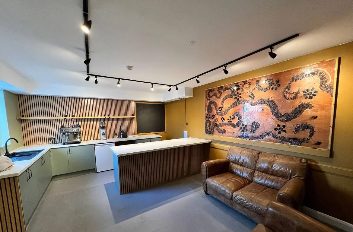 Commercial fit-out with timber island and seating