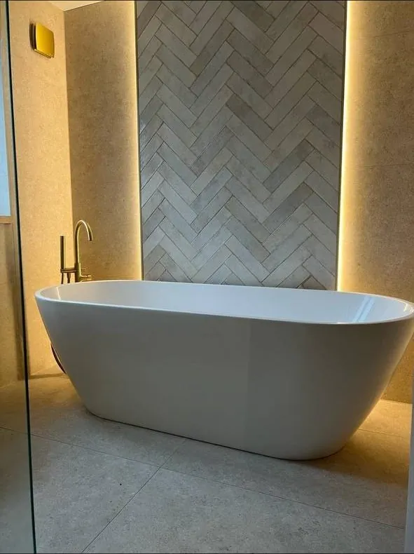 Bathroom with herringbone feature wall and LED lighting